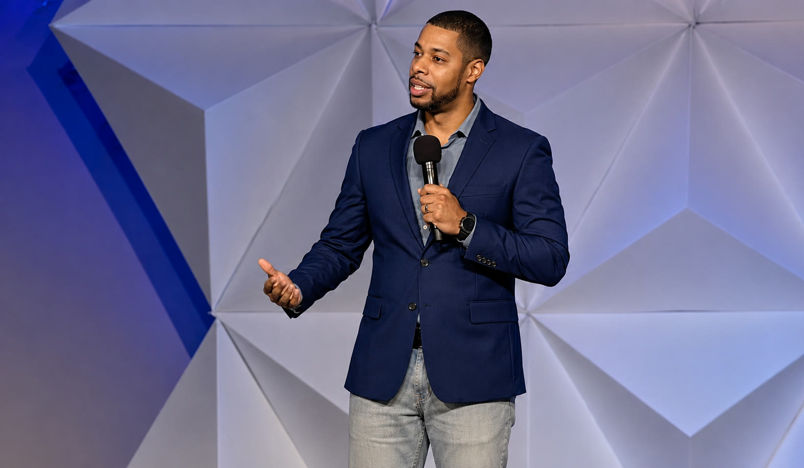 Ronald Buchanan Jr. speaking on stage.
